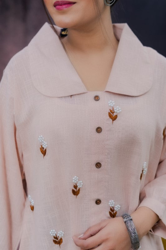 Flower embellished peach shirt