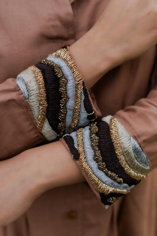 Brown shirt with cuff embellishment