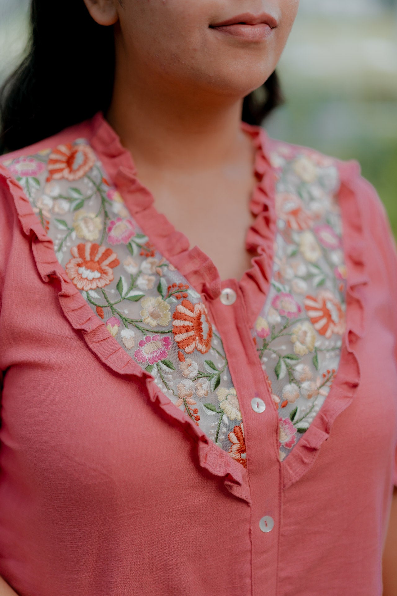Floral necklace embellished top