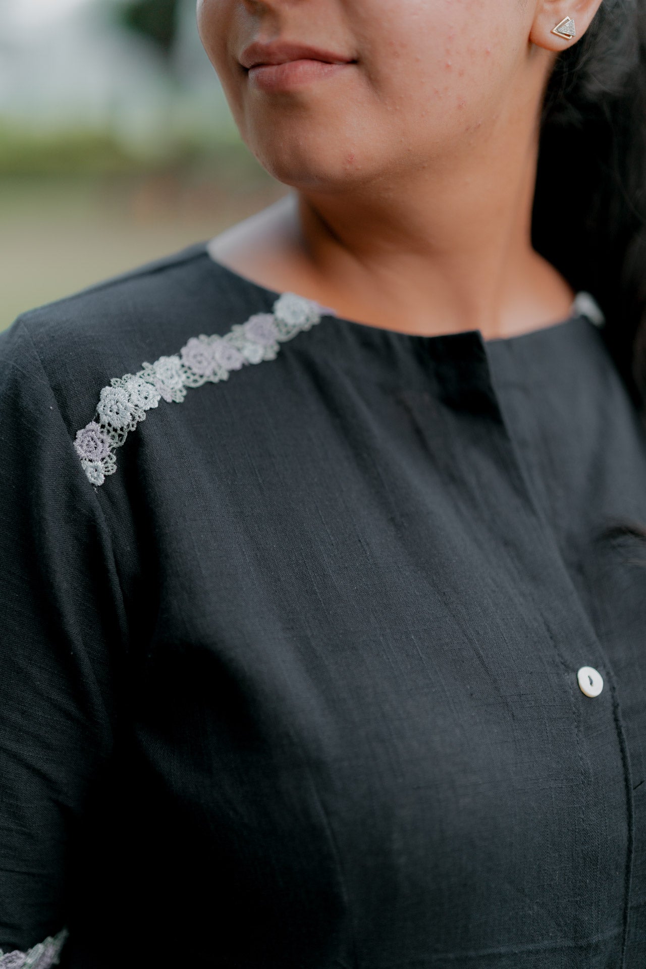 Umbrella dress with floral embellishment