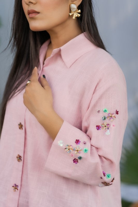 Pink shirt with flower embellishment