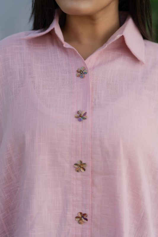 Pink shirt with flower embellishment