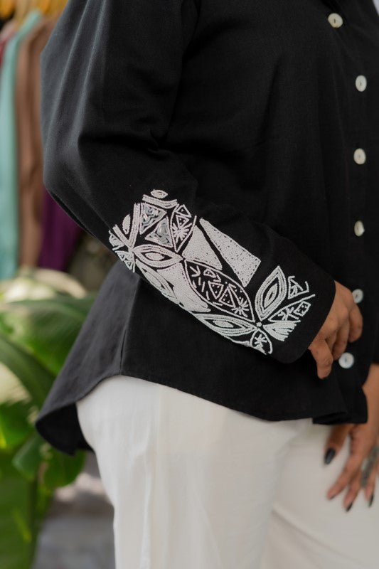 White embellishment in black shirt