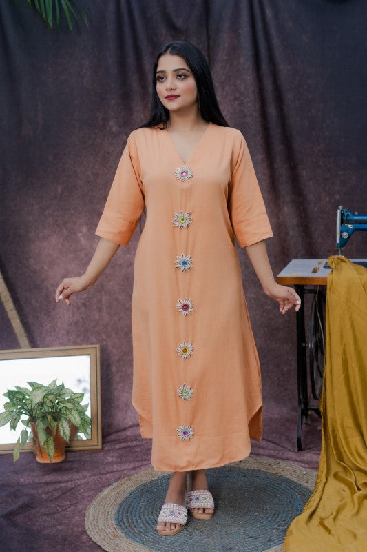 Long kurta with miror and cowrie embellishment.