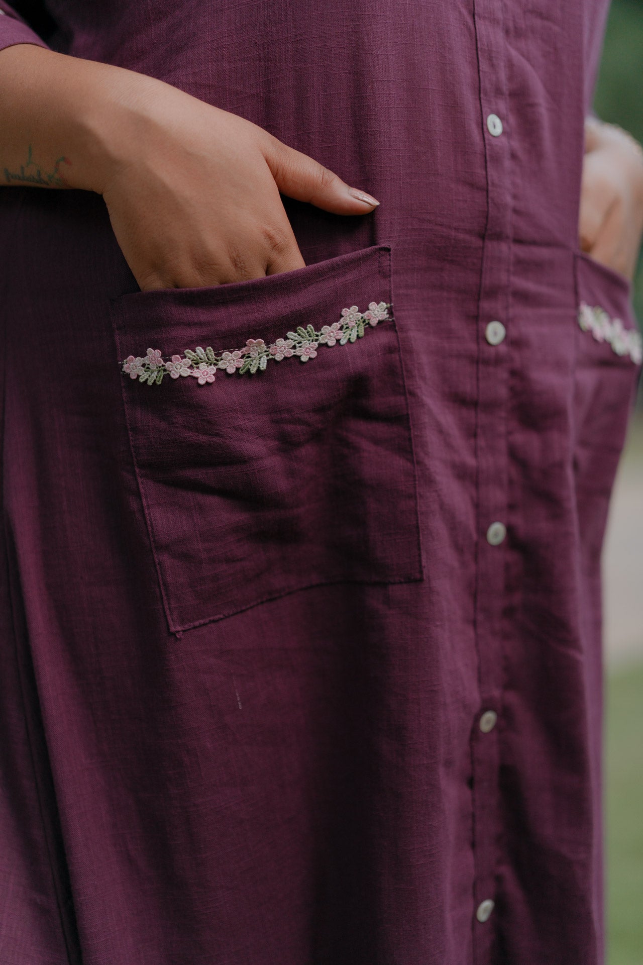 Purple frill dress with floral embellishment