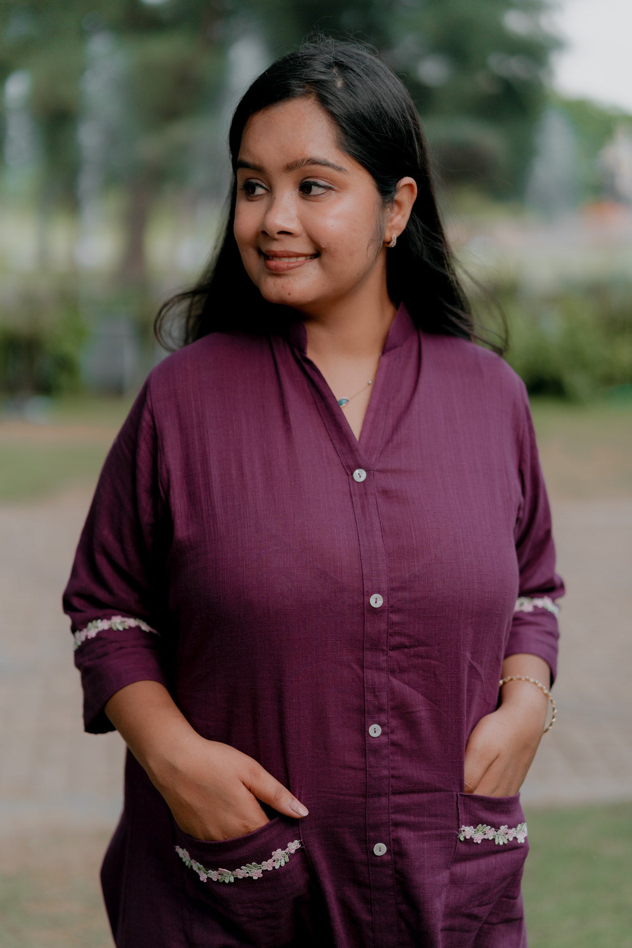 Purple frill dress with floral embellishment