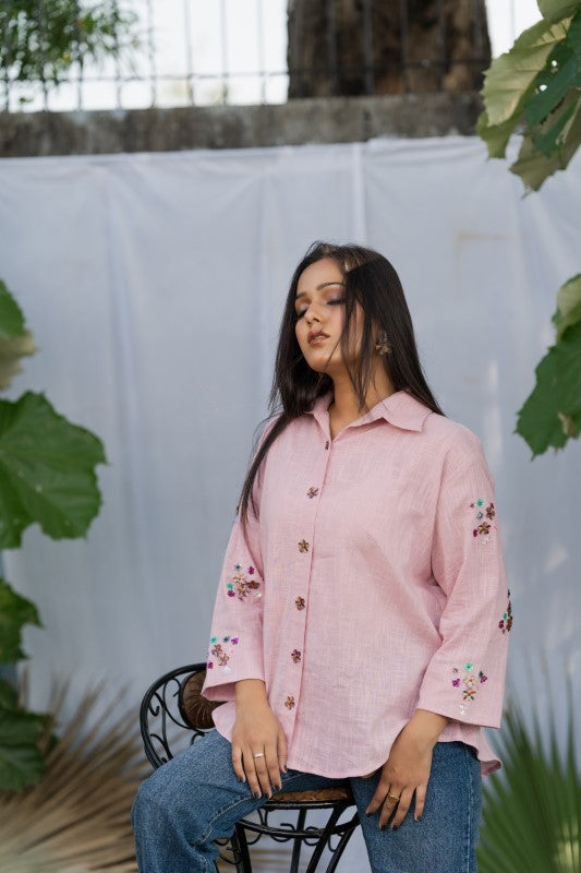 Pink shirt with flower embellishment