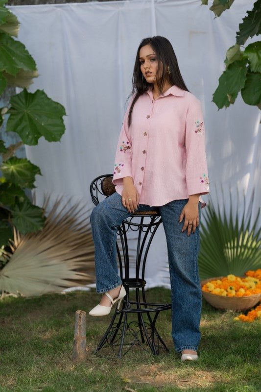 Pink shirt with flower embellishment