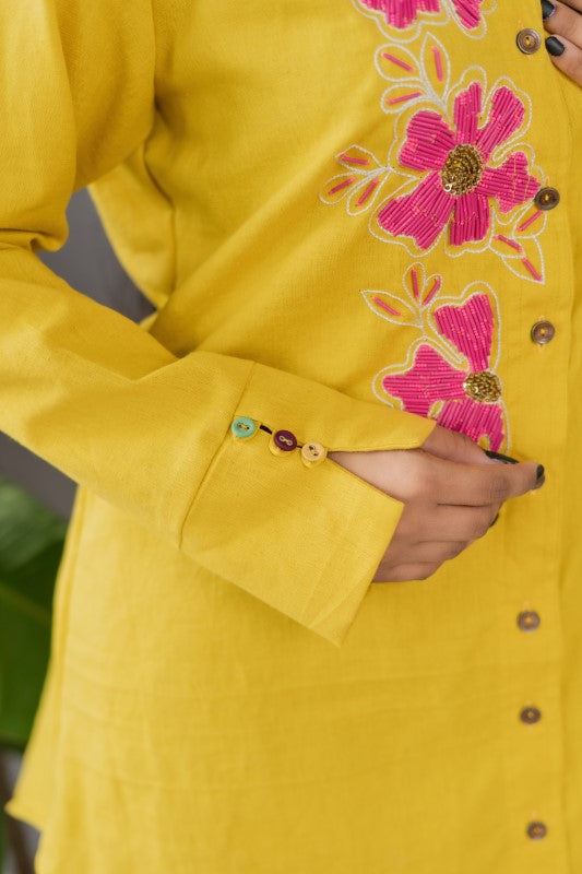 Long shirt with pink flower embellishment