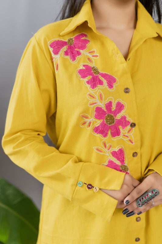 Long shirt with pink flower embellishment